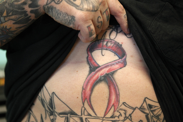 Pink tattoos tell the stories of breast cancer battles